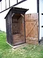 Interior of an outhouse the structure usually built over the pit to provide privacy.