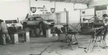 Neri and Bonacini workshop in September 1963. An ASA 1000 GTC is visible on the lift at center of image