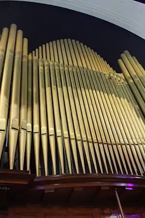 The rank of metal pipes that make up the visible face of the organ.