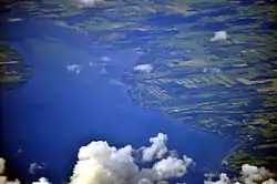Aerial view of Aurora from south by southwest, 2013. The village is along the straight stretch of the Cayuga Lake shore just above lower right of photo.