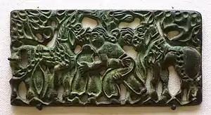 Belt plaque with design of wrestling men, Ordos region and western part of North China, 2nd century BC, bronze - Ethnological Museum, Berlin.
