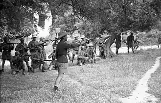 Paratroopers preparing to open fire; Horst Trebes in front