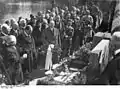 Gottfried Benn at the grave of Arno Holz