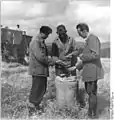 Fritz Müller (centre), chairman of the Landwirtschaftliche Produktionsgenossenschaft Seltendorf with MTS-Brigadier Georg Stenzel (left) and agricultural engineer Karl Reichenbacher, August 1958.