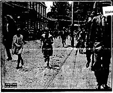 B&W photo of people running on the street