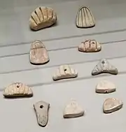 Clay tokens; circa 3500 BC (Susa II or "Uruk period"); terracotta; from Susa; Louvre (Paris)
