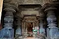 Ornate closed mantapa whose ceiling is supported by lathe turned bell shaped pillars