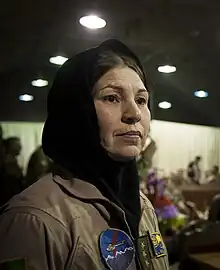 The first female Air Force helicopter pilot in Afghanistan's history Col. Latifa Nabizada exits the stage after speaking at an Afghan Air Force International Women's Day celebration at Kabul International Airport, March 07, 2013.