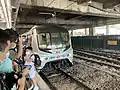 E71-E112 prepares to depart Sha Tin station for the final time