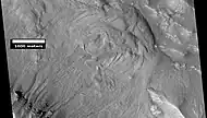 Gullies and massive flow of material, as seen by HiRISE under HiWish program.  Gullies are enlarged in next two images.  Location is Bamberg crater.