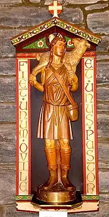Good Shepherd Votive Shrine is based on a marble statuette in the Lateran Museum and honors three children from the same family who all died in infancy.