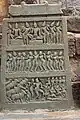 Hero stone with late 10th - 11th century old Kannada inscription depicts a battle with cattle thieves in Kalleshvara temple at Bagali