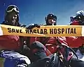 Former Gurkha officer Mike Trueman, who was born in Gosport, "protesting" on the summit of Mount Everest, 13 May 1999.