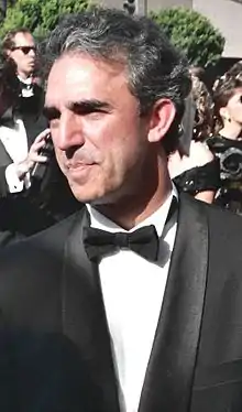 A photograph of Jay Thomas in a tuxedo and looking away from the camera.