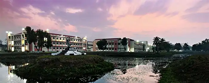 Long, three-story buildings seen over water