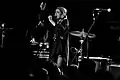 Black and white photo of a woman singing
