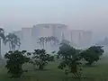 Image 10Jatiyo Sangsad Bhaban is the National Assembly Building of Bangladesh, located in the capital Dhaka. It was created by architect Louis I. Kahn and is one of the largest legislative complexes in the world. It houses all parliamentary activities of Bangladesh. This photo offers a view of the parliament building during sunrise.Photo Credit: Lykantrop