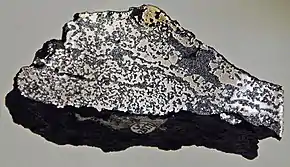 Image 16A sample of Siberian Traps basalt (dark) containing native iron (from Siberian Traps)