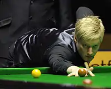 Neil Robertson after playing a shot to the middle pocket
