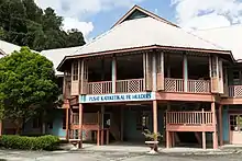 A few years earlier, Fr. Mulders had also completed another major challenge — the construction of a new block of class rooms for the St. Mary's Primary School for which he was the Principal. Prior to this, school and church functions were conducted in temporary, post WWII structures, mainly of timber, kajang and attap. In the absence of low-loaders in the 50's, Fr. Mulders' small tractor (an Allis Chalmers) had to crawl its way from the town wharf to the church site. Before this could be done, the Government road had to be protected. This was where the "forced" labour came in as a work-gang, consisting of boarders from the school was ordered to place timber planks for the bulldozer to run on and then shift them to the front as soon as the tractor had passed.