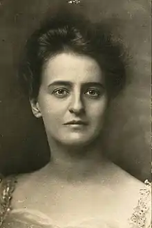 A white woman with dark hair