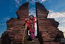Cirebonese mask dance performance around candi bentar