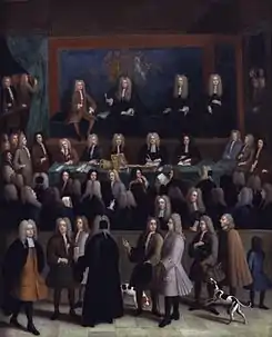 A rectangle picture of a courtroom. Dozens of men in a courtroom in 1750s era court suits and wigs. A blue wall at the back contains a coat of arms. On a raised stage at the back are four men. Several onlookers, some with dogs and children, pass by on a sidewalk looking in on the court proceedings.