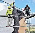 The sculptor on top of the Sacred Heart of Jesus statue