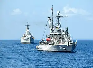Des Moines being towed to the scrapyard, in October 2006