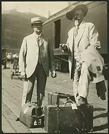 Tammen (left) standing with Buffalo Bill (right) at the Kansas City railroad depot, August 29, 1913