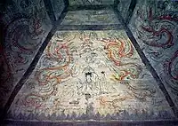 Heavens, West ceiling, Queen Mother of the West, sits opposite to the King of the East, Dong Wanggong (东王公). She is a Taoist goddess, but worship of her predates Taoism.