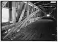 Interior view of double Burr Arches, Kings Posts, and upper truss.